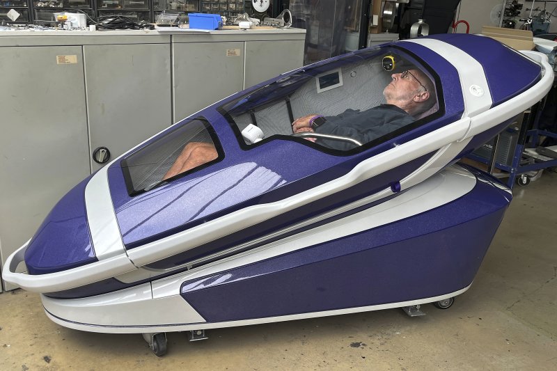 Philip Nitschke is seen inside a 'suicide pod' known as 'The Sarco' in Rotterdam, The Netherlands, July 8, 2024. (AP Photo/Ahmad Seir)