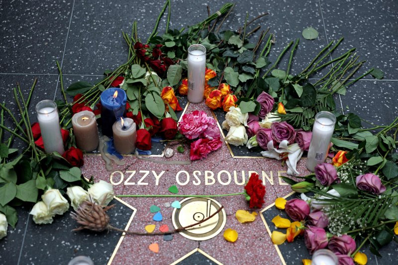 Flowers are left at a makeshift memorial at Ozzy Osbourne's Star on the Hollywood Walk of Fame on July 22, 2025, in Los Angeles. Osbourne, the legendary frontman of heavy metal group Black Sabbath, died on Tuesday at the age of 76, his family announced in a statement. "He was with his family and sur