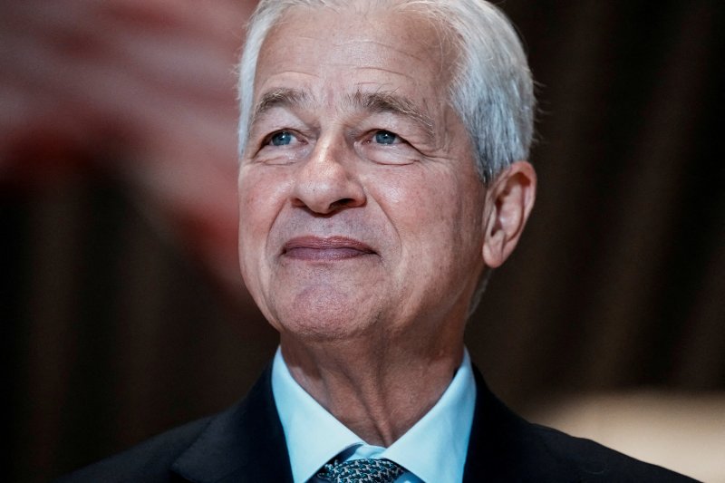 FILE PHOTO: Jamie Dimon, Chairman and Chief Executive Officer of JPMorgan Chase & Co., attends the ribbon cutting ceremony, at the firm's new headquarters at 270 Park Avenue, in New York City, U.S., October 21, 2025. REUTERS/Eduardo Munoz/File Photo