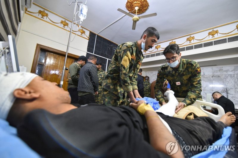 부상당한 인민동원군(PMF) 구성원들 (출처=연합뉴스)