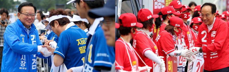 제9회 전국동시지방선거 공식 선거운동 첫날인 21일 오전 김부겸 더불어민주당 대구시장 후보(왼쪽)가 대구시 수성구 범어네거리에서, 추경호 국민의힘 대구시장 후보가 대구시 중구 반월당네거리에서 각각 선거운동원들과 악수하고 있다. 뉴시스