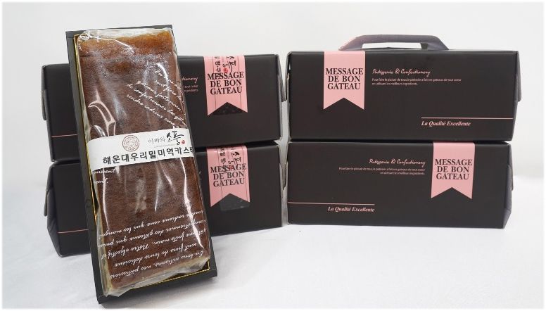 부산 해운대구가 인증한 특색식품인 금수복국의 '금수모주'(위쪽)와 가가대소의 '해운대우리밀미역카스테라'.